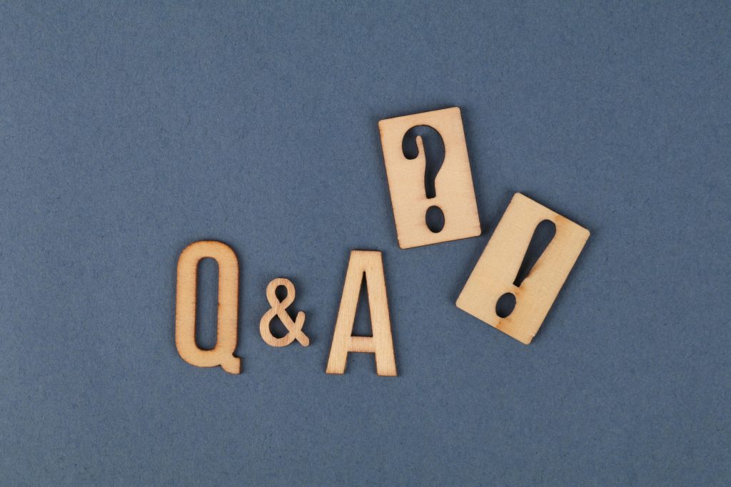 pexels photo 11082254 11082254 Flat lay of wooden Q&A letters with punctuation marks on a gray background.